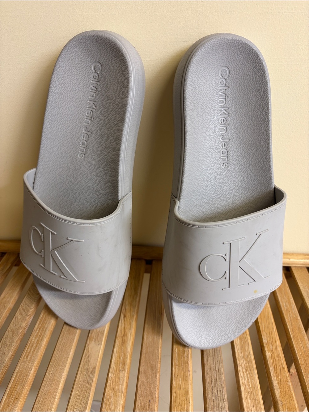 Calvin Klein Jeans gray CK embossed slide sandals